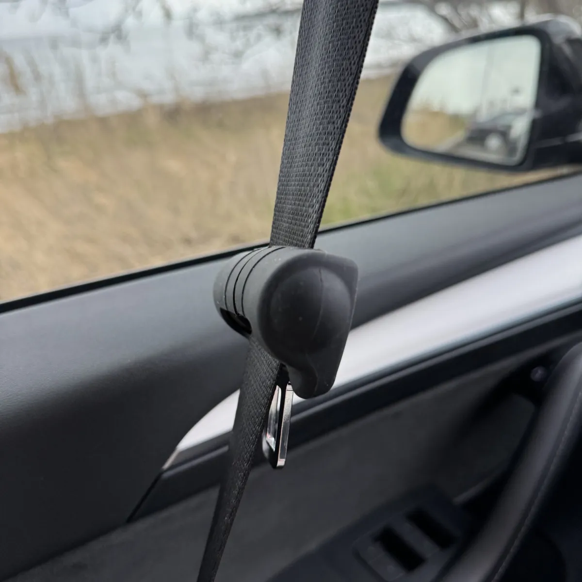 Protective rubber cover for a seatbelt