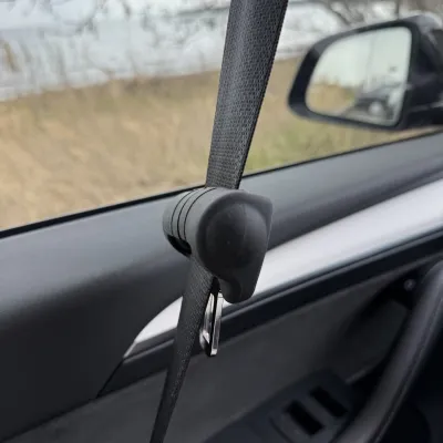Protective rubber cover for a seatbelt